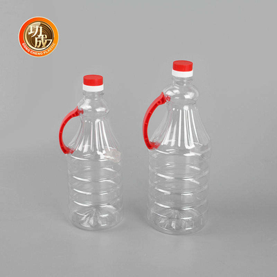 ねじ帽子のプラスチック香辛料のびんはハンドルが付いている醤油のびんをかわいがる